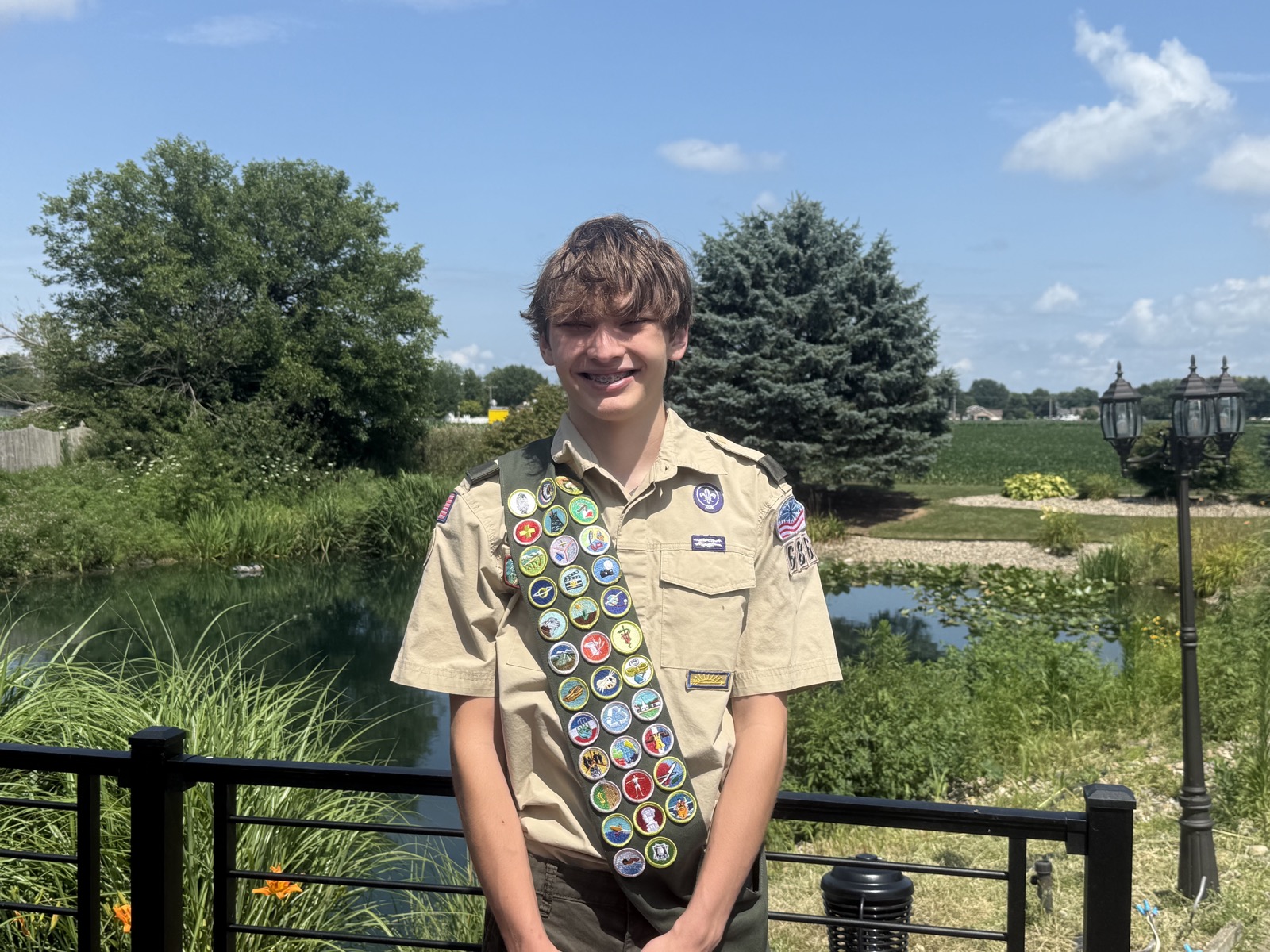 Quinn today as a Life Scout in Troop 686, in his Class A uniform and merit badge sash.